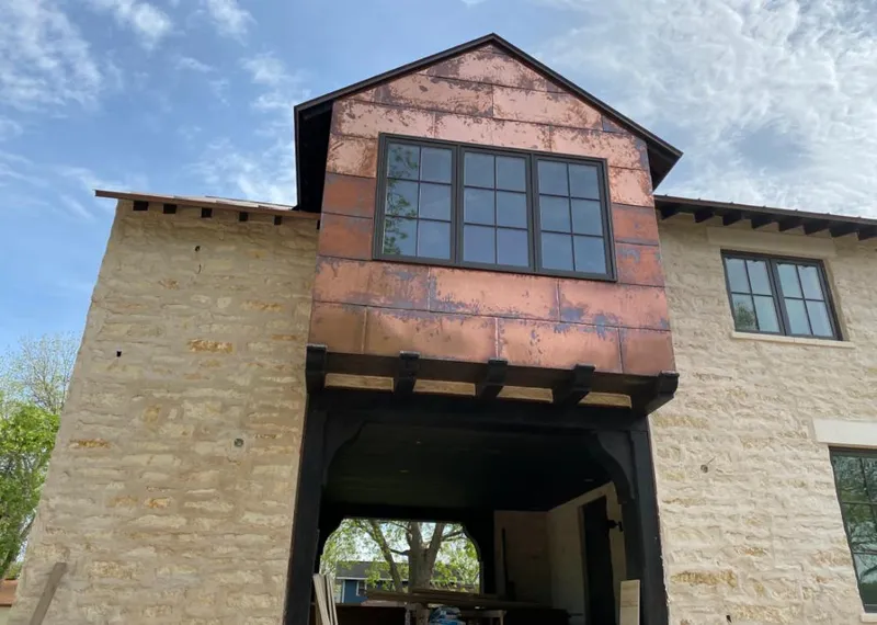 Copper metal panel facade on a stone building for Skylight Installation in Moorestown